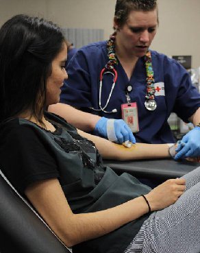 Andrea donates blood on campus at Eastfield College.