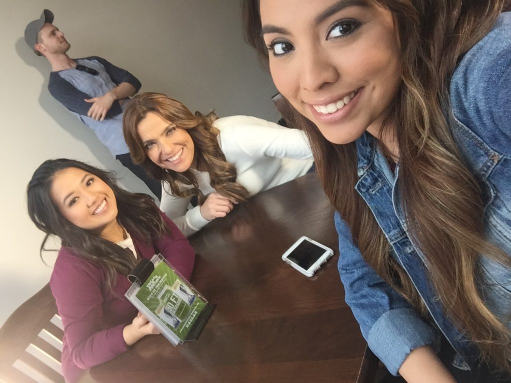 Ezra, actress Katia Prado and student Kimberly Guerrero pose for a selfie between takes.