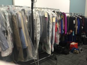 A full rack of clothes on hangers.