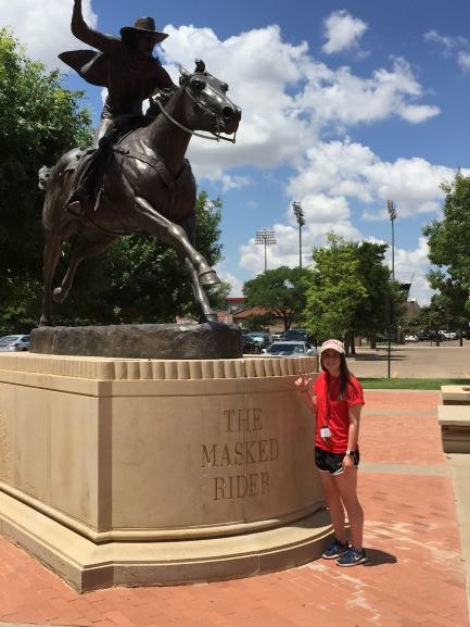 Kaitlyn Naylor, a DCCCD intern blogger. Standing in front of Texas Tech statue.